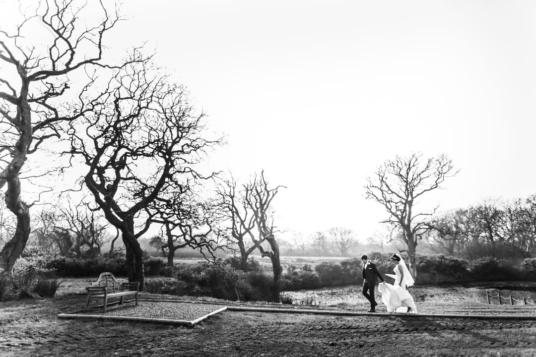 bride and groom in the field at Oldwalls, Gower, South Wales