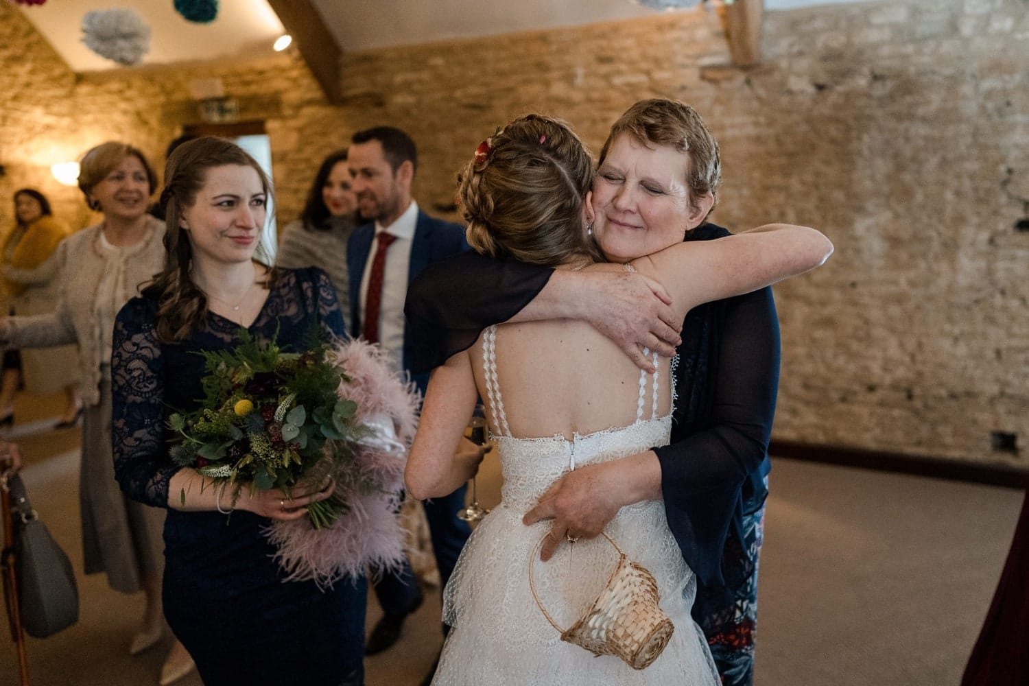 Wedding guests congratulate bride