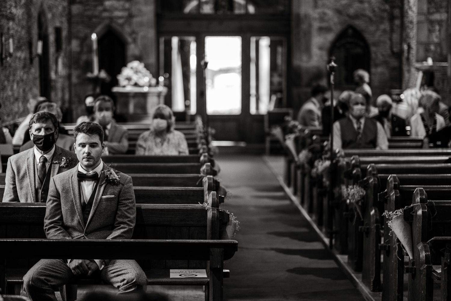 Groom waiting at church for bride in Monmouthshire, South Wales
