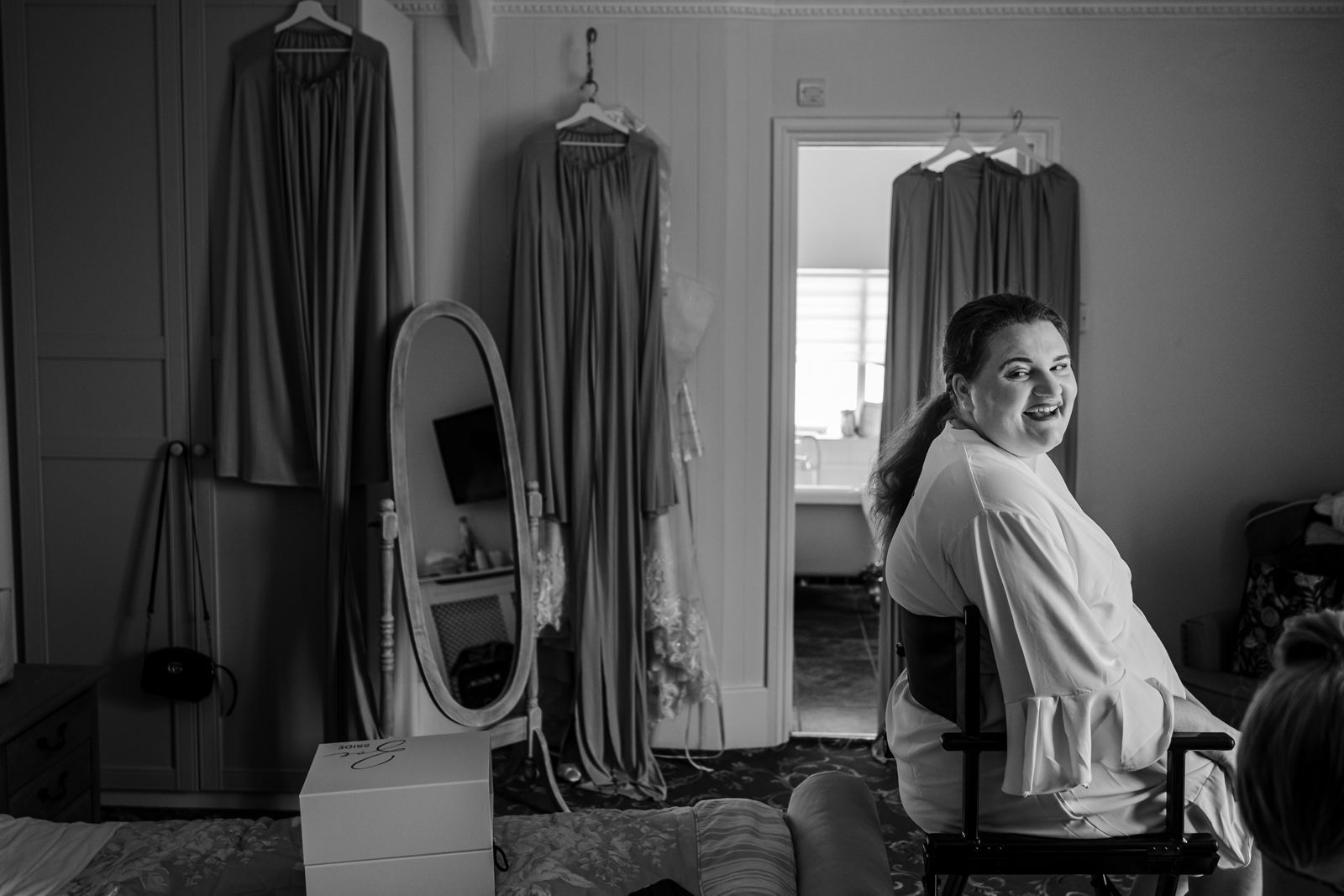 Bride laughing in make up chair