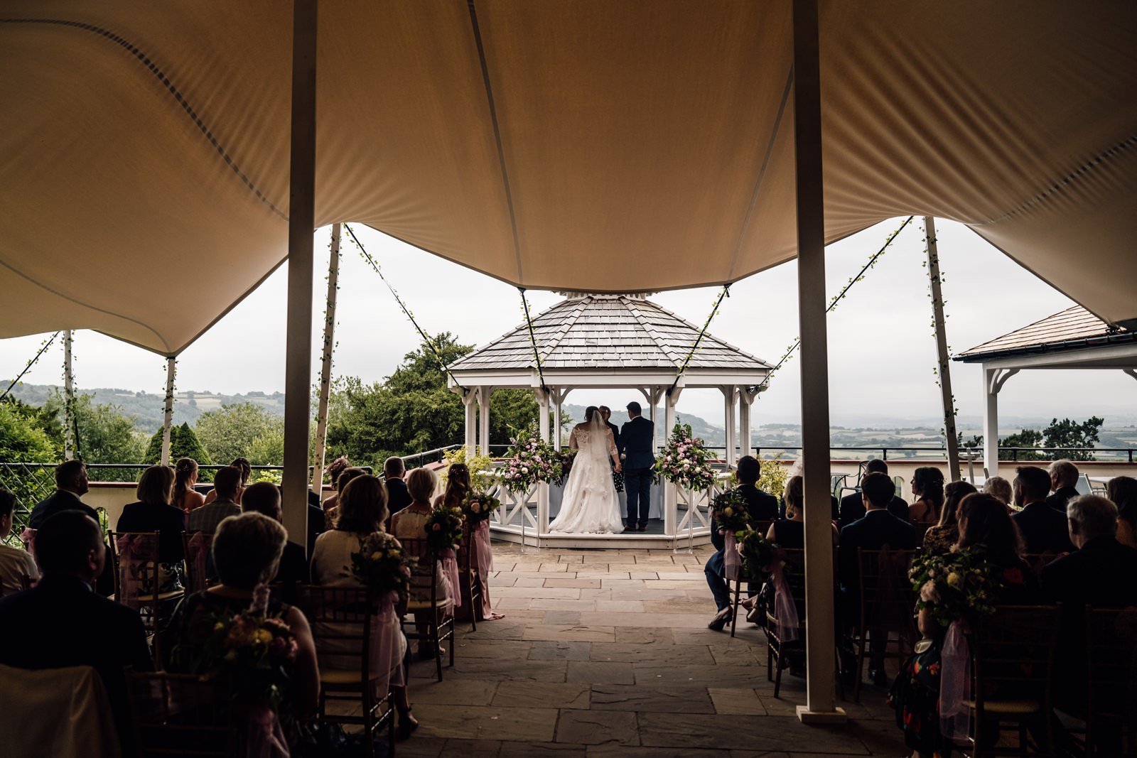 Outdoor wedding ceremony at Caer Llan, South Wales