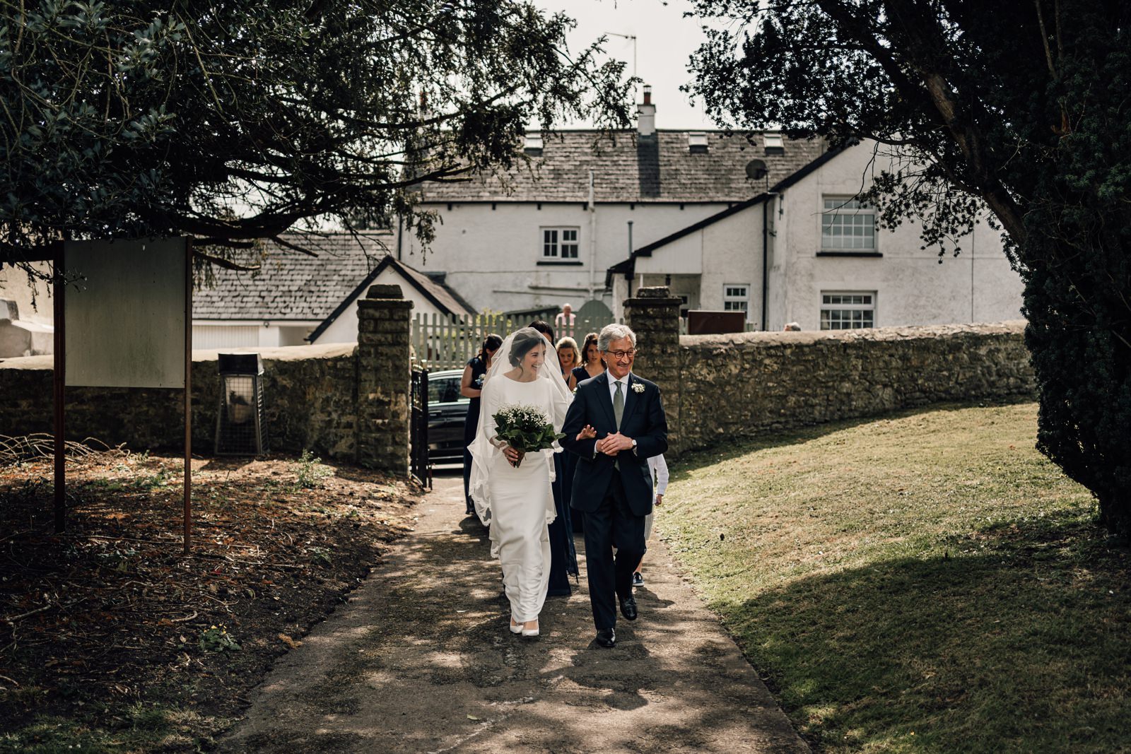 bride and father on church path