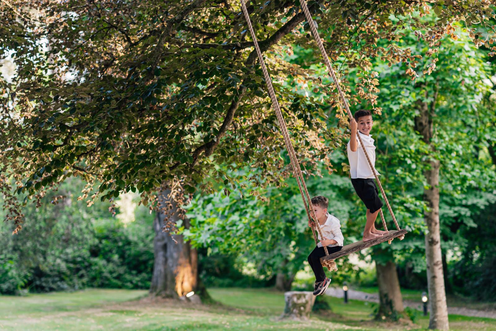 boys on tree swing at Fairyhill