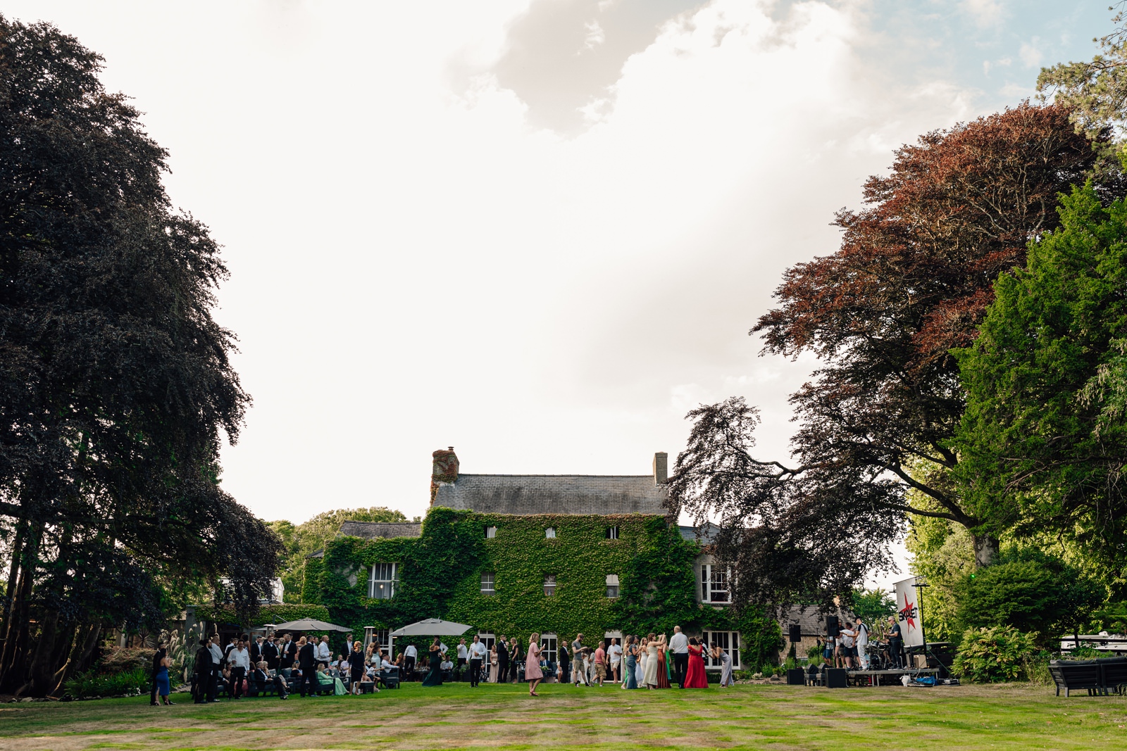 wedding guests party in garden at Fairyhill