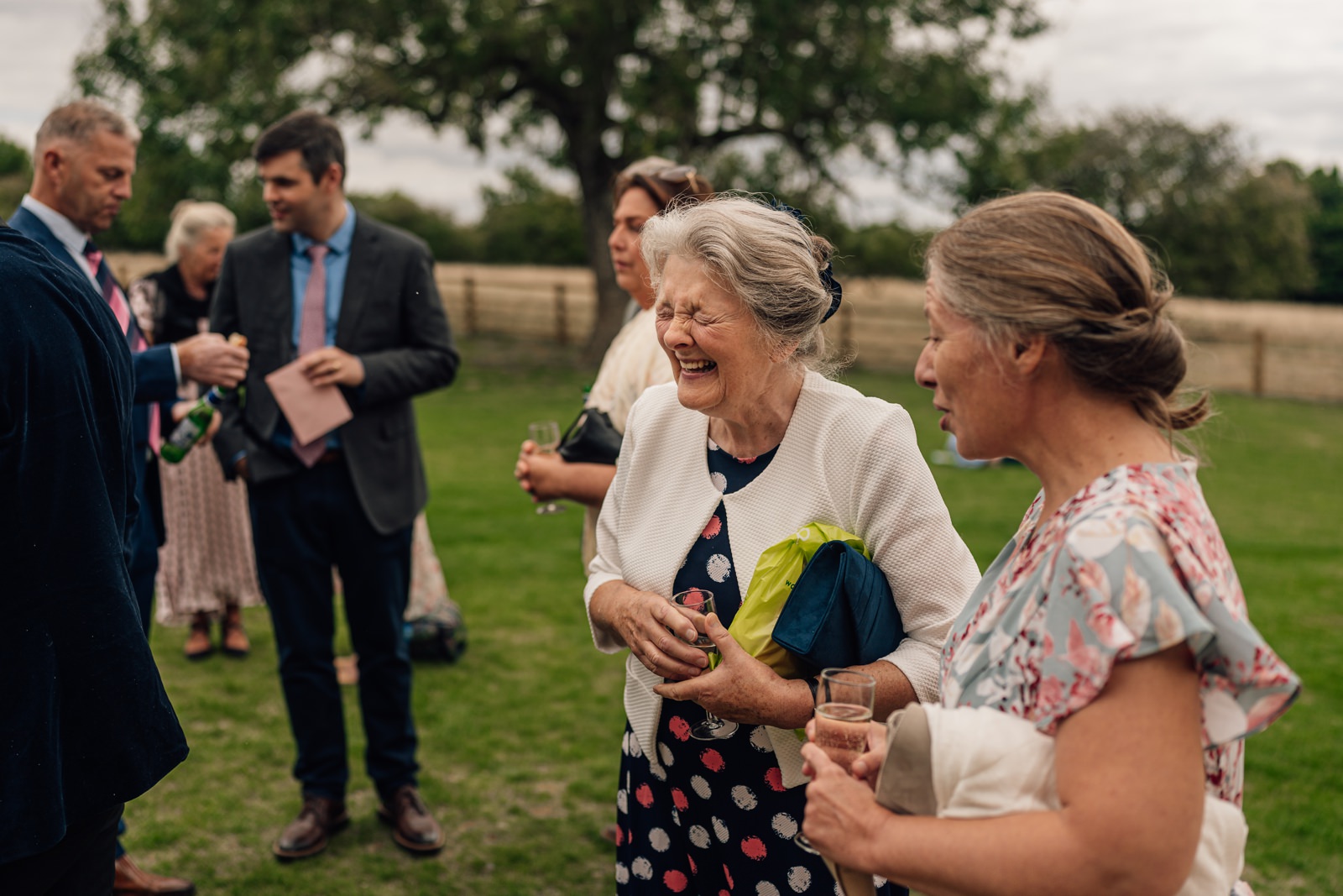 Grandmother laughs at wedding