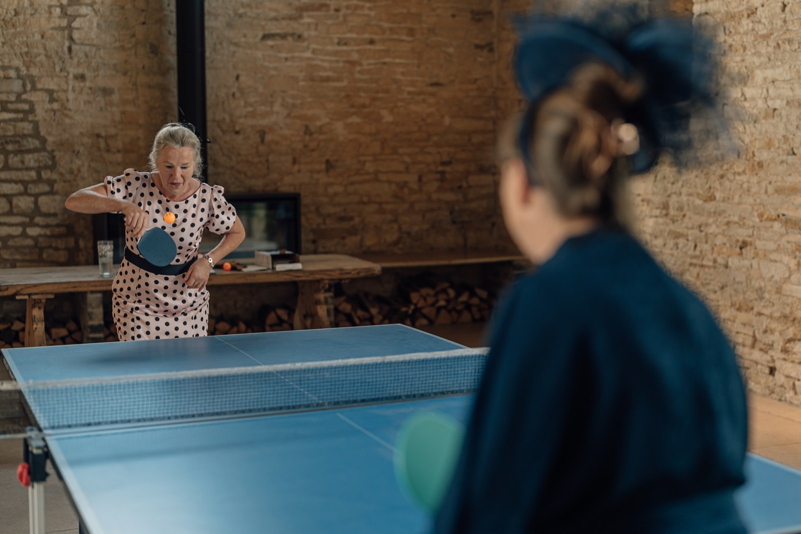 Wedding guests play ping pong