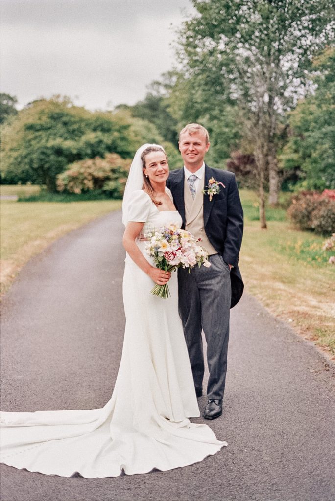 Wedding day portrait of bride and groom photographed on 35mm film